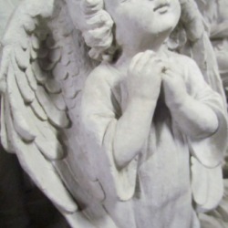 Cherub standing with folded hands